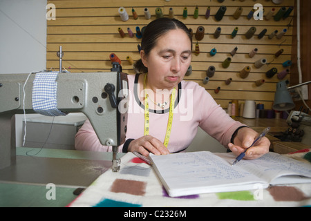 Mature woman working in the laundrette Stock Photo