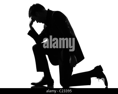 silhouette caucasian business man expressing fatigue despair tired behavior full length on studio isolated white background Stock Photo