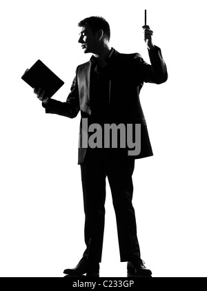 silhouette caucasian business man with note pad expressing behavior full length on studio isolated white background Stock Photo