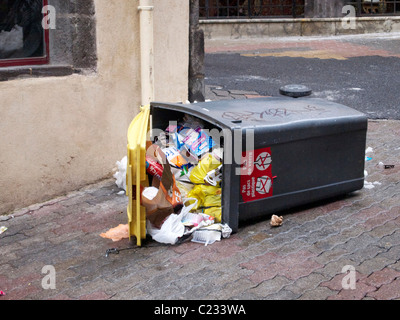 trash rubbish garbage and a knocked over dustbin garbage can in an ...