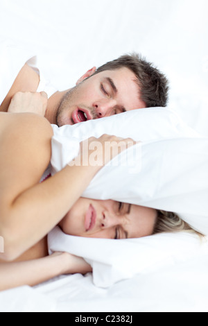 Young couple lying in bed Stock Photo