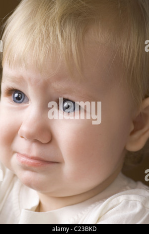 Blonde 14 month old on the verge of tears Stock Photo