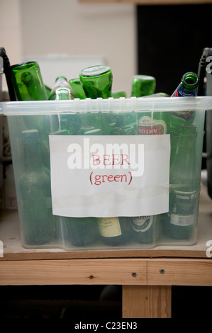 old green beer bottles ready to be reused at the Ten Green Bottles, community enterprise, New Radnor, Powys, Wales UK Stock Photo