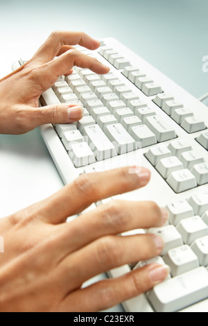 Close-up of female hands doing computer work Stock Photo