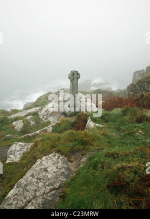 A Celtic stone cross memorial to a young botanist who died here near to Lamorna Cove on a foggy winter's day, West Country, Cornwall, England, UK Stock Photo