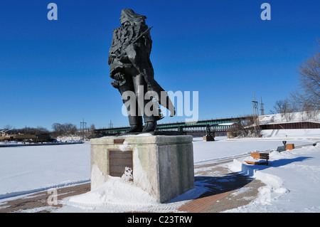 Native American, 'Ekwabet' statue erected on the banks of the Fox River to watch over the waterway St. Charles, Illinois, USA. Stock Photo