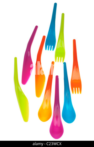 Set of three of each of brightly coloured plastic picnic knives forks and spoons Stock Photo