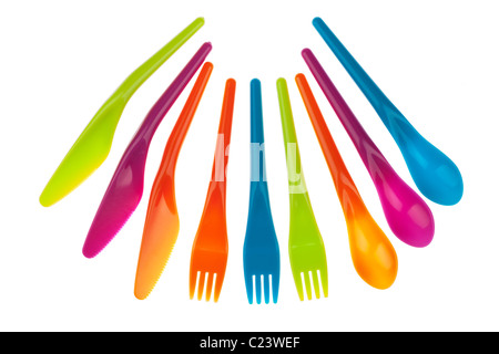 Set of three of each of brightly coloured plastic picnic knives forks and spoons Stock Photo