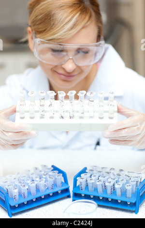 Female scientist holding samples Stock Photo