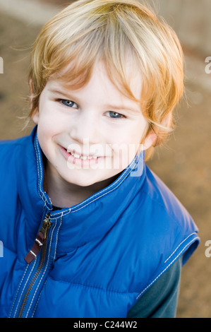 Blond hair blue-eyed boy aged 4-5 years smiling, portrait Stock Photo