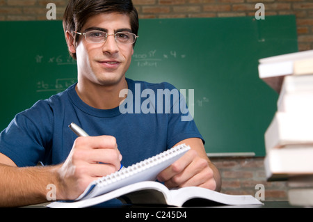 Male university student in classroom Stock Photo