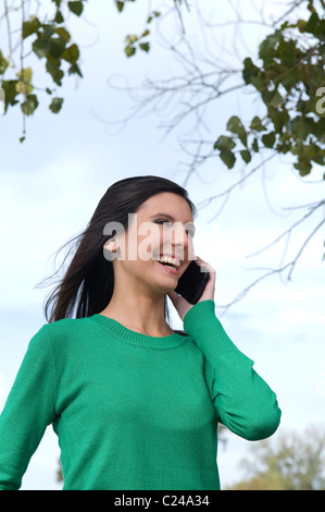 Female student talking on cellphone Stock Photo