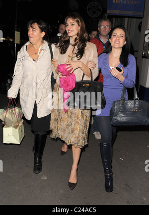 Kelly Brook leaves Cafe Koha at 11.30pm with comedienne Arabella Weir, and some other friends, who take turns to try and hide Stock Photo