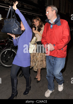 Kelly Brook leaves Cafe Koha at 11.30pm with comedienne Arabella Weir, and some other friends, who take turns to try and hide Stock Photo