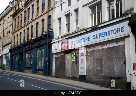 Street of boarded up shops in Bradford, West Yorkshire, England UK Stock Photo