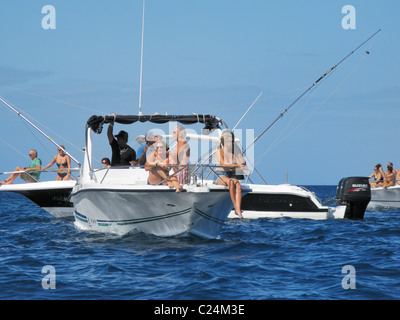 Tourists snorkeling and swimming with dolphins in the Baie de la Grande Rivière Noire, La Preneuse, Black River, Mauritius. Stock Photo