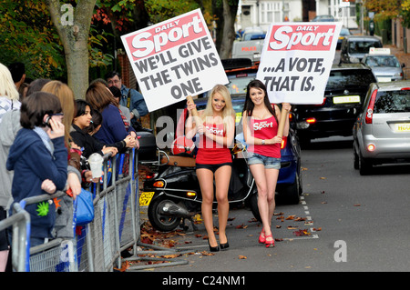 The Daily Sport girls declare their support for the twins John and Edward outside the 'X Factor' house London, England - Stock Photo