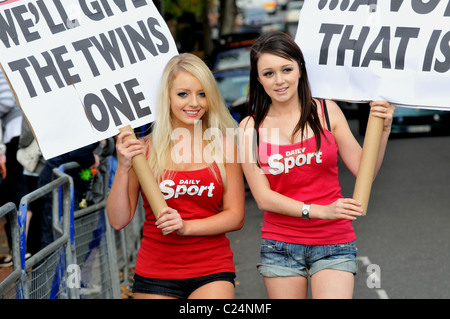 The Daily Sport girls declare their support for the twins John and Edward outside the 'X Factor' house London, England - Stock Photo