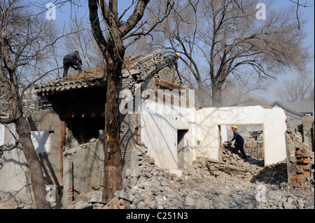 Chinese workers demolishing historical buildings in central Beijing, China. 20-Mar-2011 Stock Photo