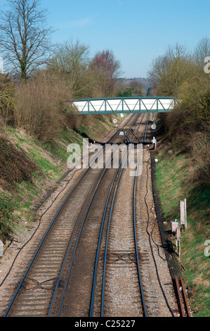 Bridge over railway track running through Dorking, Surrey, England UK Stock Photo