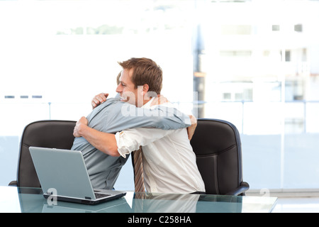 Happy businessmen congratulating each other on a sucess Stock Photo
