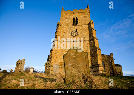 The restored exterior with its clock tower of All Saints Church on the Viking Way in Walesby Stock Photo