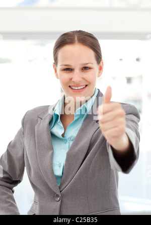 Happy businesswoman doing a thumbs up Stock Photo