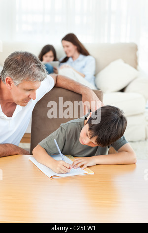 Father helping son with homework Stock Photo - Alamy