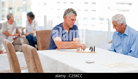 Seniors playing chess Stock Photo