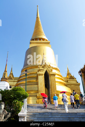 Tourists Visiting the Grand Palace and Temple of the Emerald Buddha in Bangkok, Thailand Stock Photo