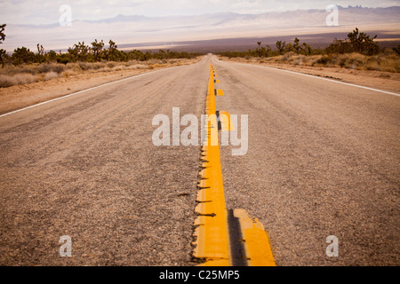 Stretch of empty road through the Mojave Desert in the Mojave National Preserve, San Bernardino, CA Stock Photo