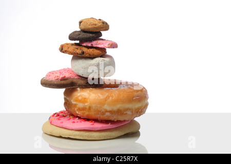 pile of cookies and donuts cutout on white background Stock Photo