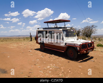 A Land Rover on safari in the Masai Mara , Kenya , Africa Stock Photo