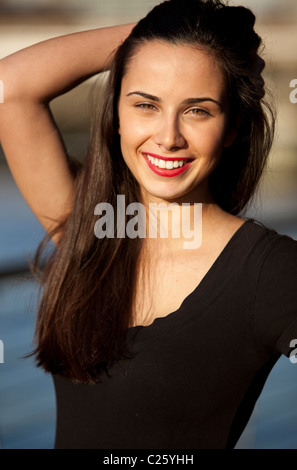 Portrait of a young beautiful woman in her 20s smiling, London, England, UK Stock Photo