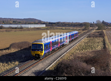 First Great Western 166 217 forms a Paddington - Hereford service seen running along the Cotswold Line at Lower Moor on 8/2/11 Stock Photo