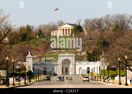 Arlington House, also known as the Robert E. Lee Memorial on top of the hill of Arlington National Cemetery. The shot is taken from Memorial Bridge looking west. In the foreground is the entrance of the cemetery with the John F. Kennedy gravesite directly behind that. Stock Photo