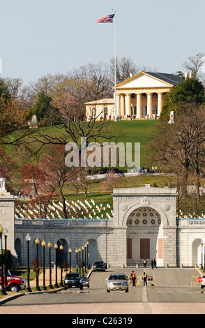 Arlington House, also known as the Robert E. Lee Memorial on top of the hill of Arlington National Cemetery. The shot is taken from Memorial Bridge looking west. In the foreground is the entrance of the cemetery with the John F. Kennedy gravesite directly behind that. Stock Photo