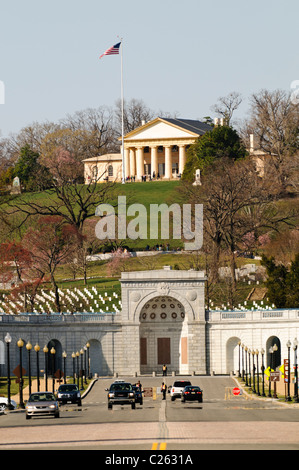 Arlington House, also known as the Robert E. Lee Memorial on top of the hill of Arlington National Cemetery. The shot is taken from Memorial Bridge looking west. In the foreground is the entrance of the cemetery with the John F. Kennedy gravesite directly behind that. Stock Photo