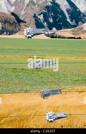Wire fence tensioners in New Zealand's Canterbury High Country Stock Photo