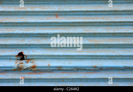 Old rusty blue corrugated iron plate texture detail Stock Photo