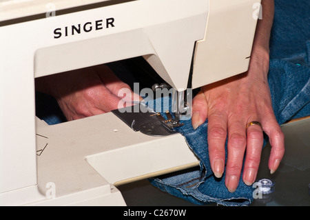Woman Using Sewing Machine Stock Photo