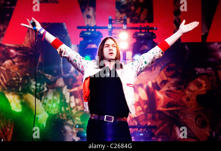 Singer and front man Tom Meighan of British indie rock band Kasabian performs on the Pyramid Stage at Glastonbury Festival. Stock Photo