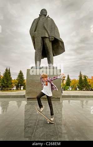 Skateboarding in Novosibirsk Russia in front of the giant statue of Lenin outside the Opera House