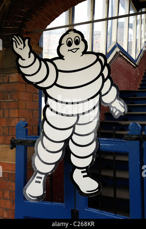 Michelin man on railway platform england uk Stock Photo