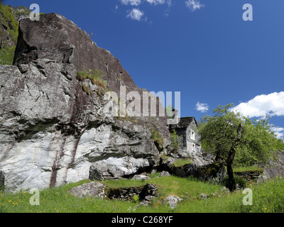 old house in  a rock wall of rough stone  in valley of Bavona  the wildest of all Ticino, Switzerland Stock Photo