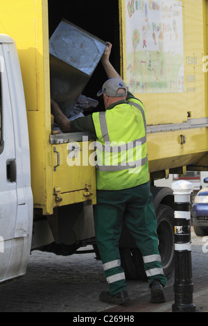 A council worker empties the bins in Lewes town center, East Sussex, England. Stock Photo