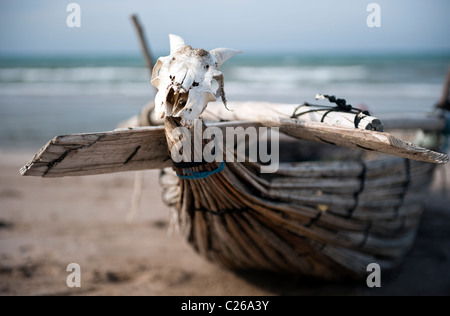 Traditional Omani fishing boat on the beach near Muscat Stock Photo