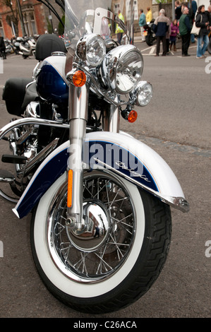 Chromed Harley Davidson V Twin Deluxe Motorcycle parked up in Wootton Bassett High Street during the Ride of Respect parade Stock Photo