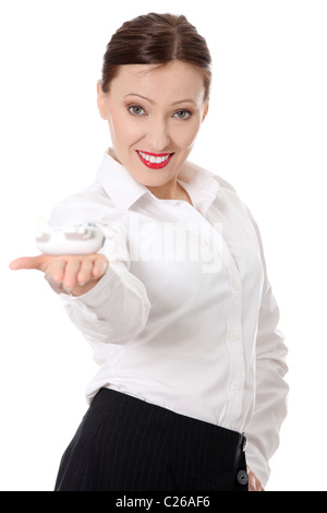 Happy mature businesswoman showing small plane model (toy), isolated on white Stock Photo