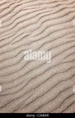 Natural background of sand in ripple wave pattern Stock Photo
